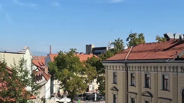 riding up funicular lift cable car above city in ljubljana slovenia european capital in europe scenic mountains red roof buildings moving upwards