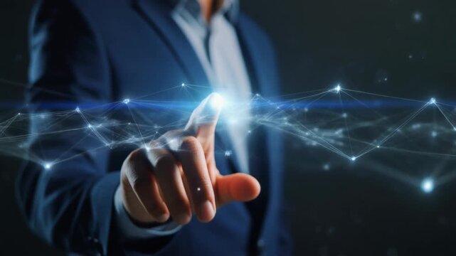 "Person in dark blue suit pointing toward glowing digital network of nodes and lines, symbolizing innovation, connectivity, and human interaction with futuristic technology."
