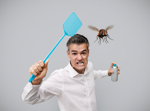 Angry man killing insects