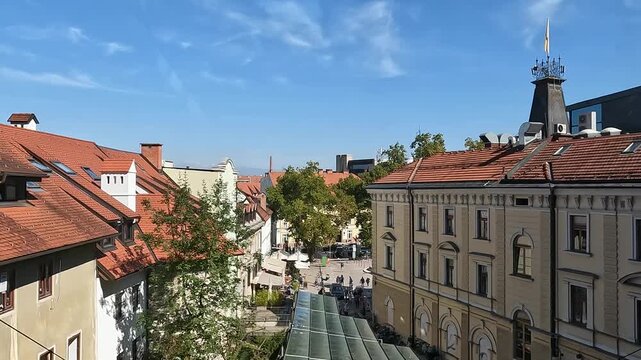 riding up funicular lift cable car above city in ljubljana slovenia european capital in europe scenic mountains red roof buildings moving upwards
