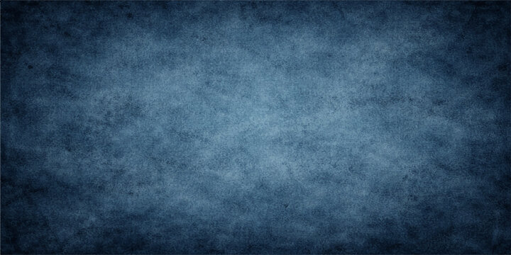 A dark blue grunge texture on an aged vintage wall background provides a rough blank surface for a dirty blackboard design with a textured paper pattern and grungy backdrop