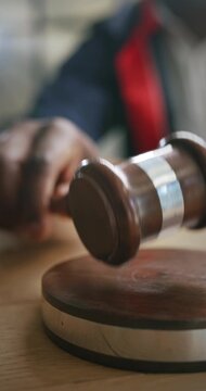 Judge hitting the gavel to finalize a decision