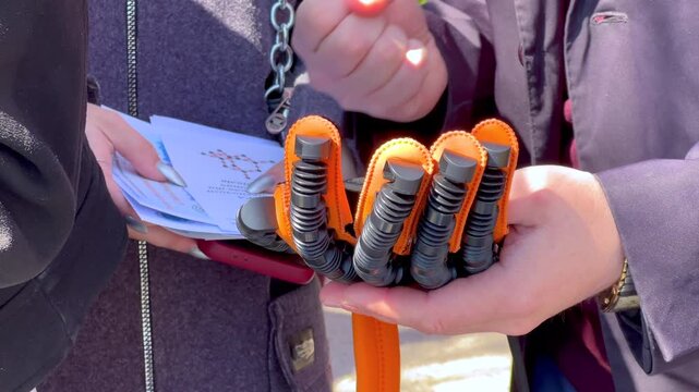 Person demonstrating bionic prosthetic hand technology