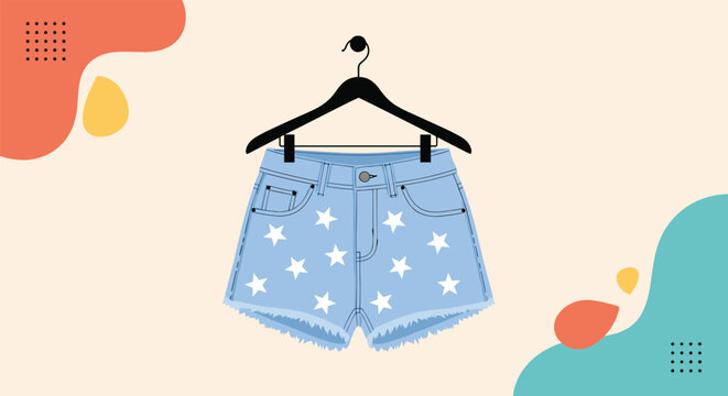 Blue denim shorts with white star patterns hanging on a black clothes hanger against a decorative background.