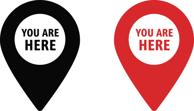 Map pins containing the text you are here provide visual navigation cues for locating positions on physical or digital geographic layouts.