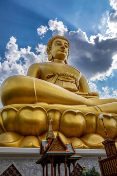 Bangkok, Thailand - March 15 2026 : The giant seated buddha statue at the Wat Paknam Phasi Charoen temple, Famous place in Bangkok.