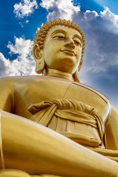Bangkok, Thailand - March 15 2026 : The giant seated buddha statue at the Wat Paknam Phasi Charoen temple, Famous place in Bangkok.