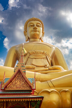 Bangkok, Thailand - March 15 2026 : The giant seated buddha statue at the Wat Paknam Phasi Charoen temple, Famous place in Bangkok.