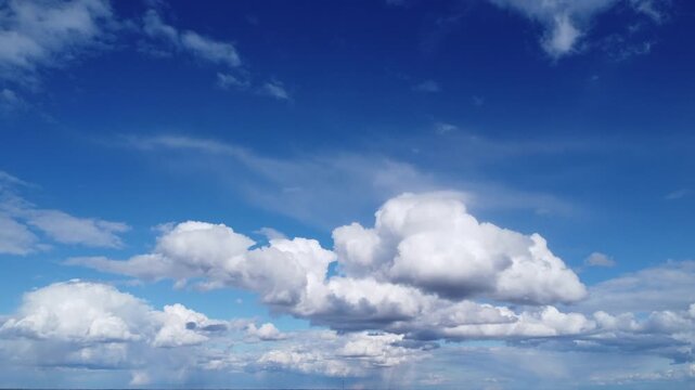 Dreamy cinematic sky clouds 4K, majestic white clouds floating in clear blue sky, heavenly aerial perspective, tranquil weather background for travel and meditation, bright sunny day atmosphere, slow 