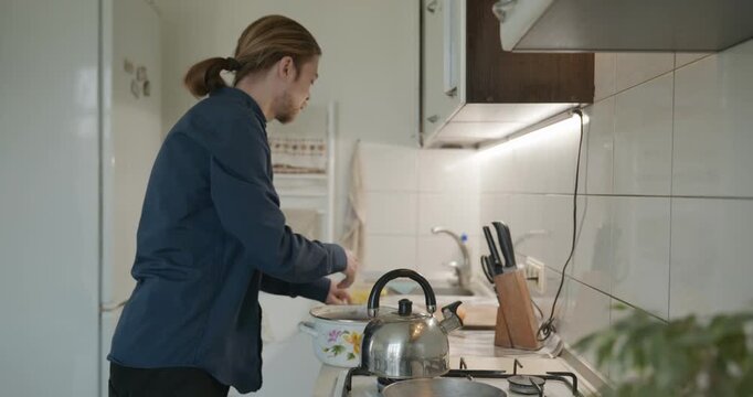 Caucasian man prepares desert at kitchen at home. 4K 10-bit