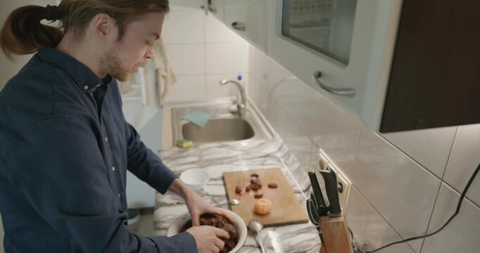 Caucasian man prepares desert at kitchen at home. 4K 10-bit