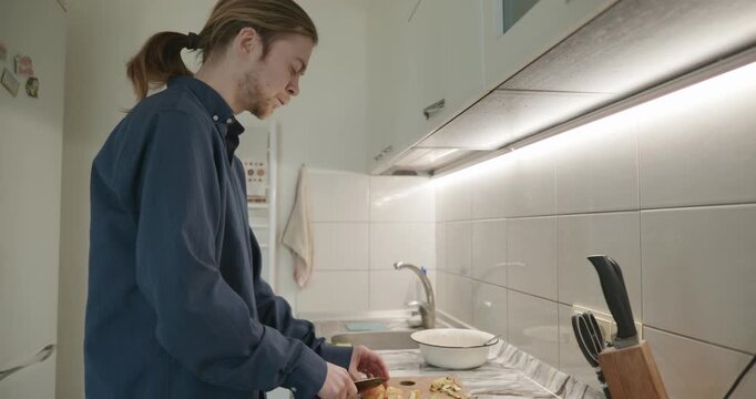 Caucasian man prepares desert at kitchen at home. 4K 10-bit