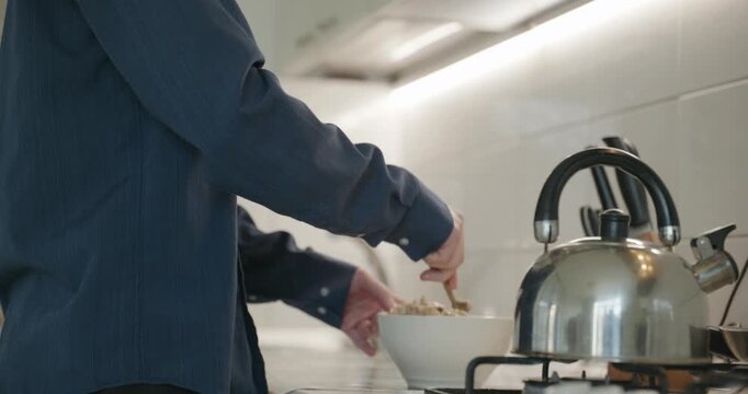 Caucasian man prepares desert at kitchen at home. 4K 10-bit