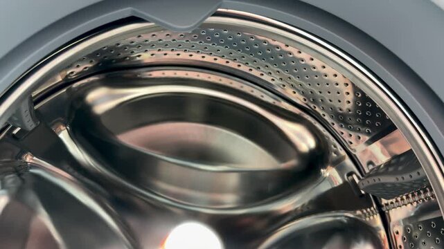 Close-up steel drum rubber seal detailing showroom display polished stainless surface with precise gasket, reflective chrome
