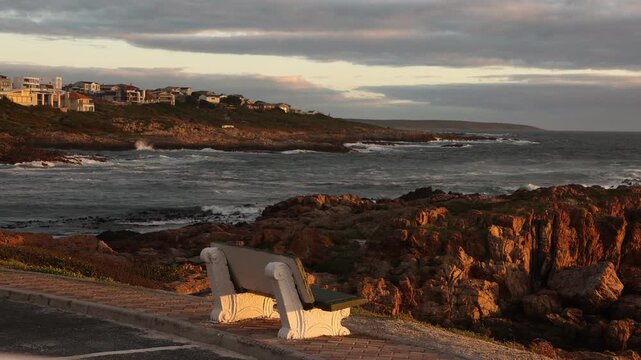 sunset light over rocky coastline of DeKelders, Gansbaai, South Africa