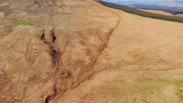 Carter Bar Scotland: 14th March 2026: Striking drone view of the countryside next to the A68 Scottish Borders. Forest of trees and hills fill the scene. Sitka spruce trees