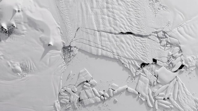 Panoramic shot on glacier flowing into sea, cracking in pieces making icebergs. Camera is zooming in, rotating clockwise. Animation based on image by NASA