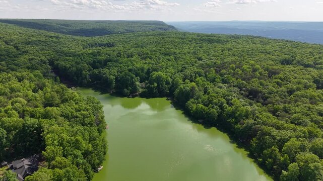 Drone Footage of Mountain Lake with Dramatic Rock Escarpment and Curving Shoreline Menlo Georgia