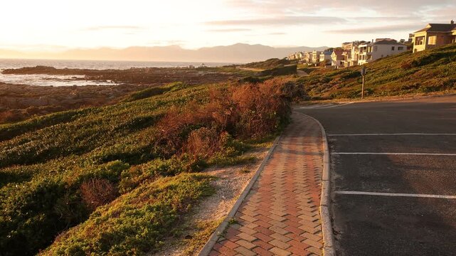 sunset light over rocky coastline of DeKelders, Gansbaai, South Africa