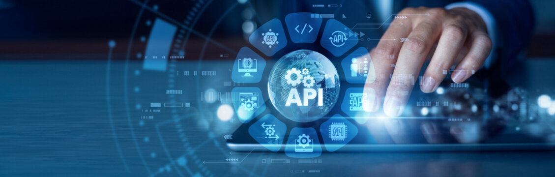 Software development. Programmer working on tablet testing secure API integration and cloud services in modern tech world. Digital database network, coding system and web architecture.