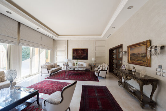 Modern Middle Eastern Arab family gathered in a luxurious bright living room with traditional rugs
