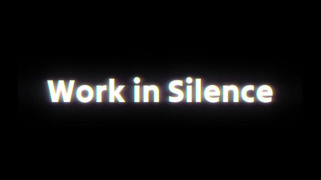 Glowing text that says work in silence on a black background