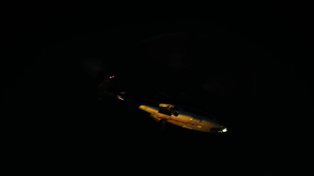 Helicopter flying slowly in the sky