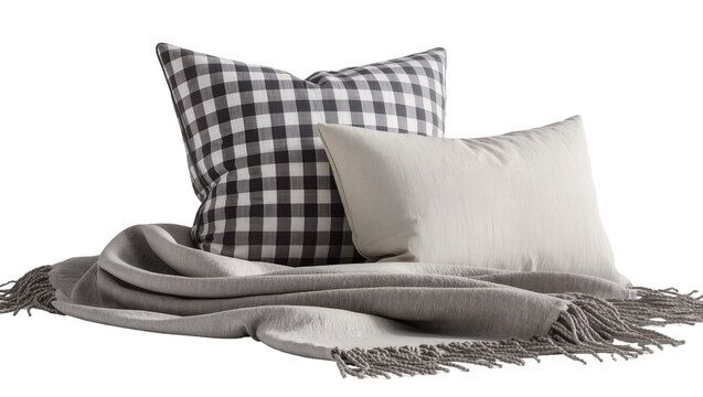 Black and white checkered pillow with cream pillow and grey throw, isolated on transparent background