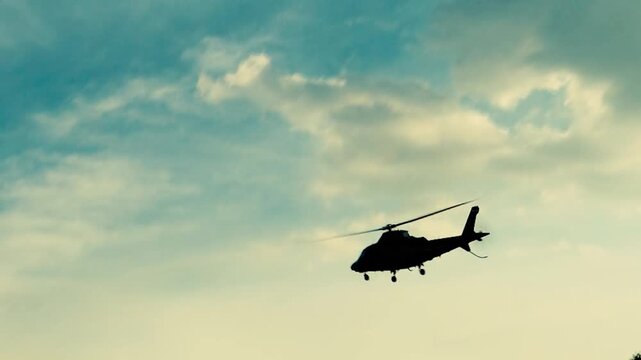 Helicopter flying slowly in the sky