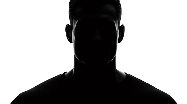 Anonymous man's identity concealed in dark silhouette