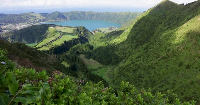 A mountain range with a volcanic lake in the foreground at Sete Cidades.