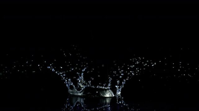 Super Slow Motion Shot of Water Crown Splash Isolated on Black Background at 1000fps.