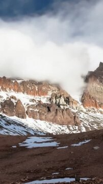 Aconcagua, a mountain in the Andes Mountains between Chile and Argentina. Time lapse in vertical video