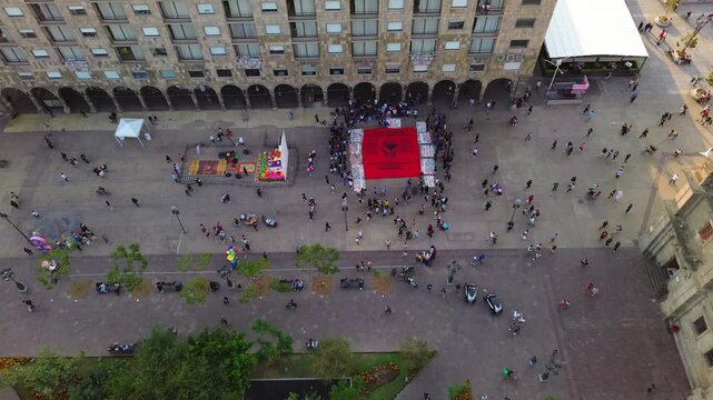Guadalajara, Jalisco Mexico; October 10 2025. A protest installation for missing persons at Plaza de Armas in front of the Government Palace is captured via aerial drone view at sunset.