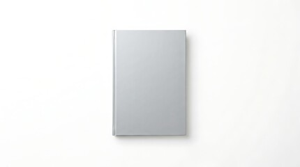 Fototapeta premium A plain grey notebook viewed from above on a white background with notebook overhead background
