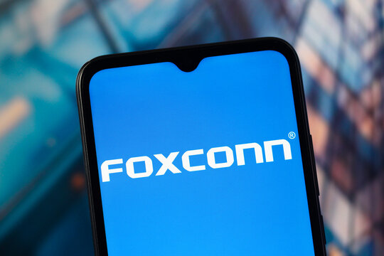 In this photo illustration, the Foxconn logo is seen displayed on a smartphone screen.