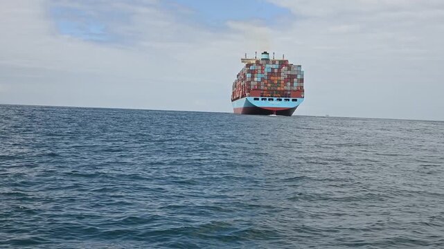  Full container ship on smooth seas.