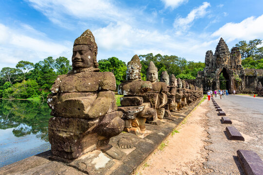Stone statues leading to Angkor Thom gate