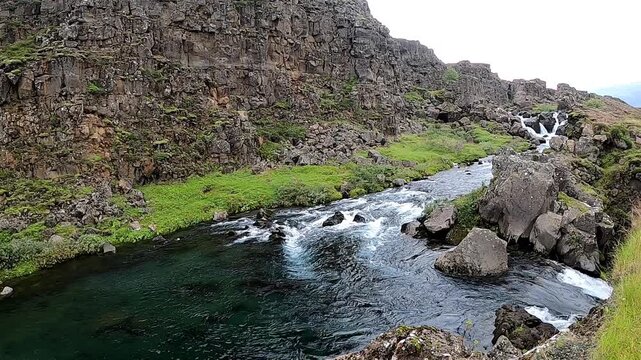 Crystal clear &Ouml;xar&aacute; river flowing through Almannagj&aacute; fault, Iceland