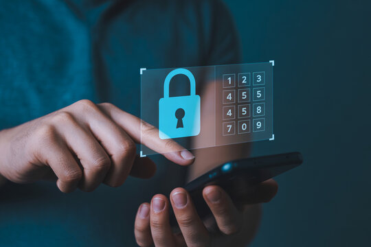 Digital security and data protection concept, hand using smartphone with padlock icon and keypad for password entry for secure access and privacy protection in technology.