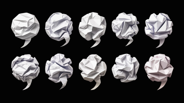 collection of crumpled white paper comma shapes against a black background