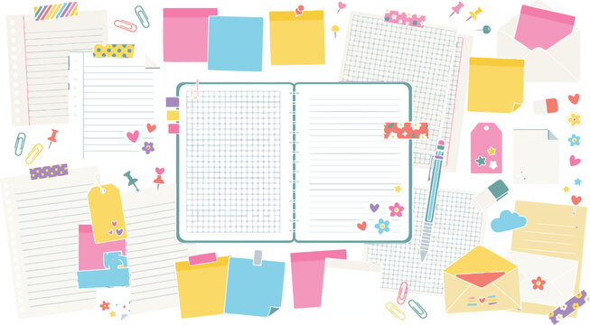 Stationery flatlay with open notebook colorful paper clips tags and decorative elements on white