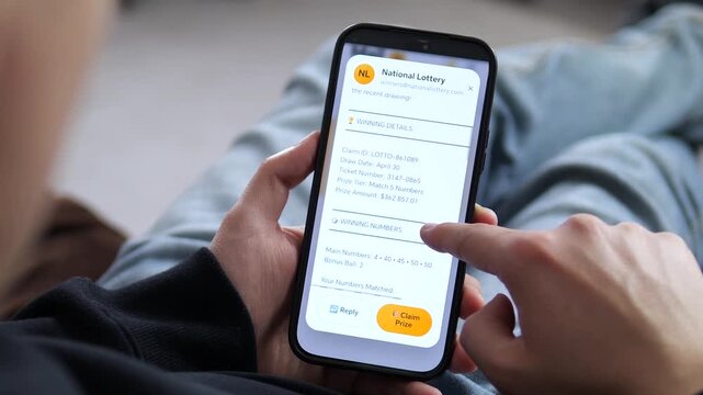 Receiving a National Lottery win notification on a smartphone. The screen displays Congratulations Youve Won with a prompt to claim. Perfect for lottery apps, gambling visuals, and prize-winning