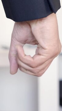 Closeup of fist of angry man, frustrated and stress businessman at workplace.Corporate employee upset, furious and conflict while feeling violence, anger or fight at a workplace after conflict at work