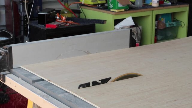 Cutting a 1/4 sheet of plywood lengthwise on a table saw