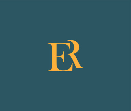 Elegant interlocking gold letters E and R forming a stylish monogram on a deep teal background
