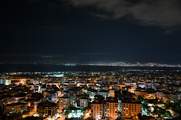 Obraz premium Izmir coastal skyline at night, city lights panorama