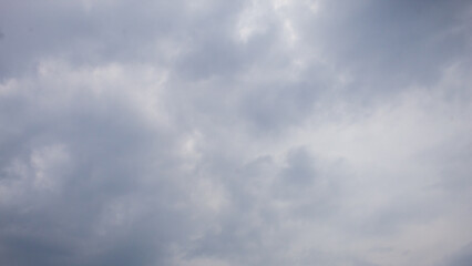 Fototapeta premium The background view of the sky is dominated by thick and dark clouds, which is often associated with cloudy weather or about to rain.