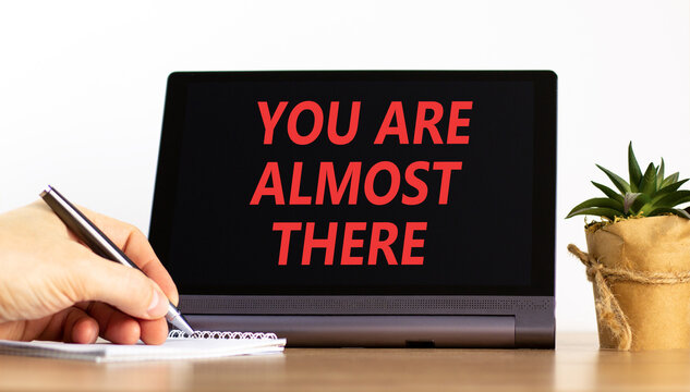 You are almost there words symbol. Concept words You are almost there on beautiful black tablet. Beautiful white background. Business You are almost there motivational support concept. Copy space.