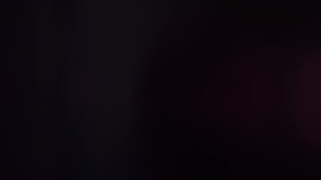 Real Shooted Lens Flare Transitions on Black Background in Slow Motion.